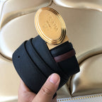 Prada belt with gold oval buckle and dark strap; brown section at keeper.