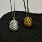 Logo-printed round pendant necklace with layered silver-tone chains