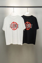 Maison Margiela graphic T-shirt pair: white and black with red face numbers print