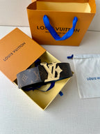 Louis Vuitton monogram belt with dark strap and gold-tone LV buckle, side view