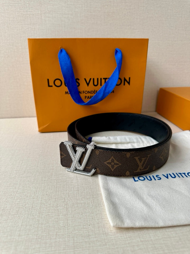 Dark monogram belt with silver-tone gold LV-style buckle on dark strap