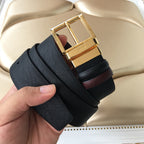 Leather belt, black textured strap with gold buckle