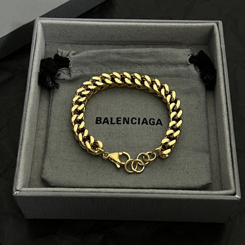 Balenciaga chain bracelet in gold tone with black ties and BALENCIAGA center tag