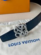 Louis Vuitton belt detail: dark blue leather with silver-tone knot buckle