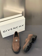Brown suede loafers shown from side and back with logo plaque strap