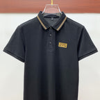 Black polo shirt with embroidered logo tape on collar
