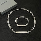 Balenciaga silver chain necklace with matching short bracelet and logo tags