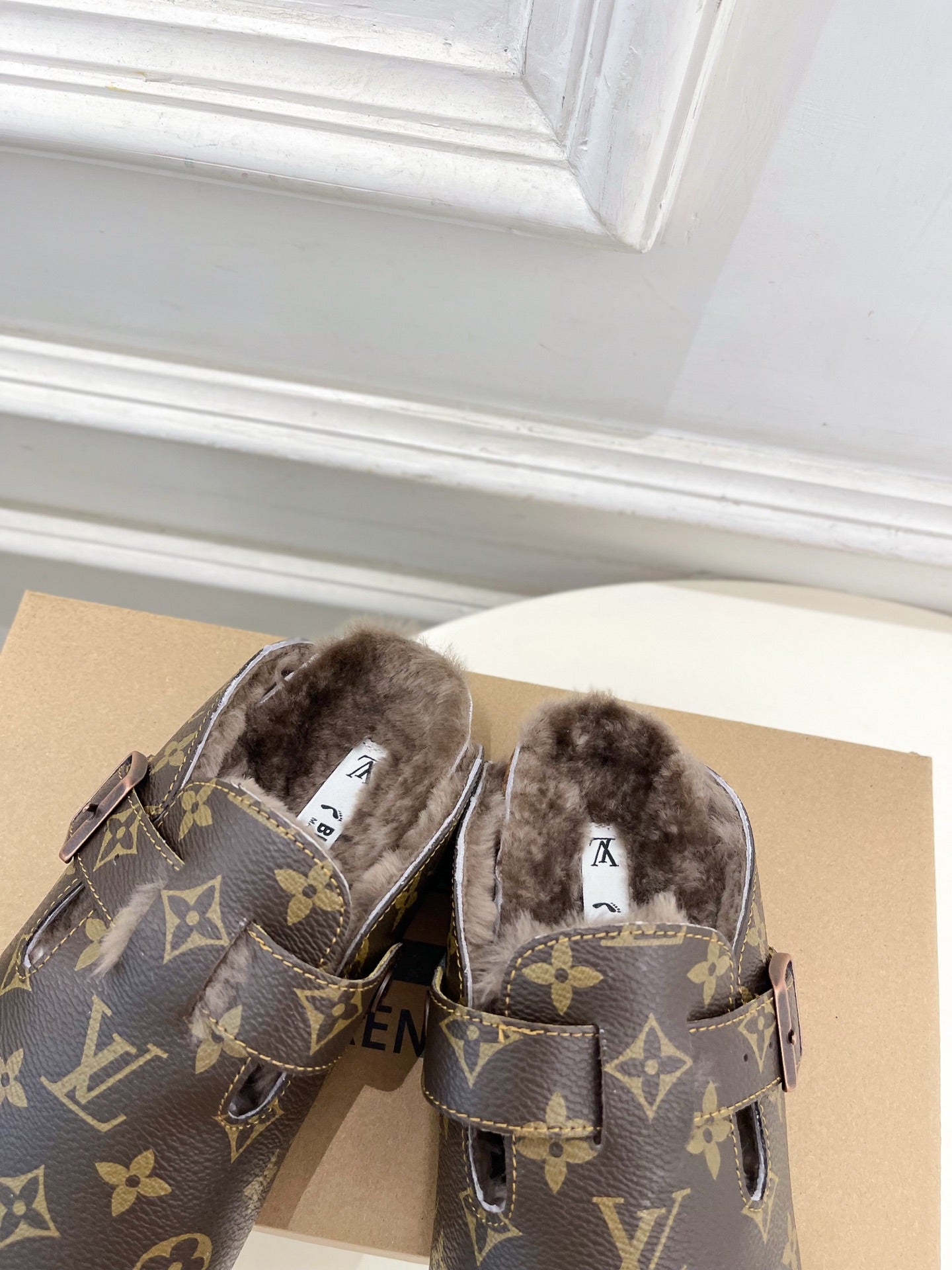 Louis Vuitton monogram sandals with faux-fur insole and buckled straps