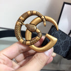 Gucci belt close-up: gold double-G buckle with textured detailing on dark strap