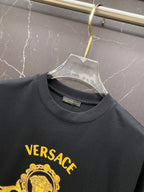Black Versace T-shirt chest logo print in yellow-gold.