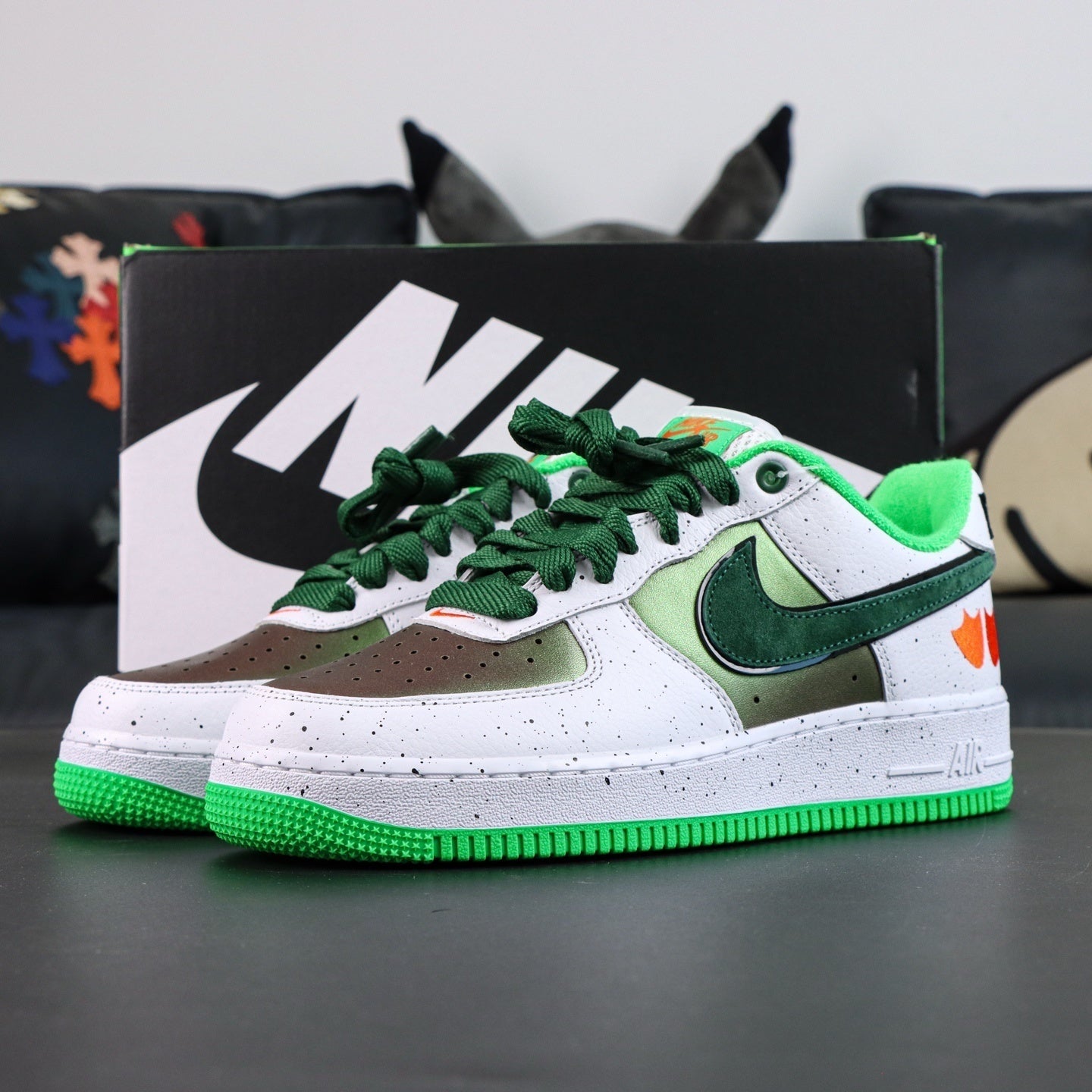 Air Force 1 sneakers, white upper with green swoosh and green laces; low profile.