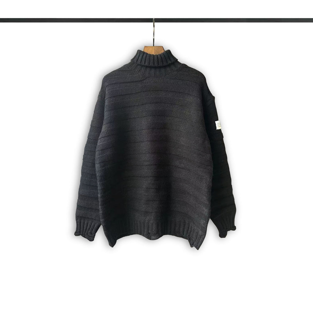 Turtleneck knit sweater in dark charcoal with ribbed collar, hem, and cuffs