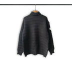 Turtleneck knit sweater in dark charcoal with ribbed collar, hem, and cuffs