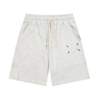 Heather gray Maison Margiela shorts with elastic waist, drawstring, and dash graphic.