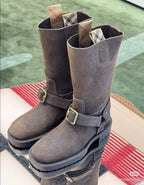 Gray suede tall boots with two side buckle straps and chunky platform sole
