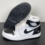 White and black high-top sneakers with black outsole tread and blue accent near collar