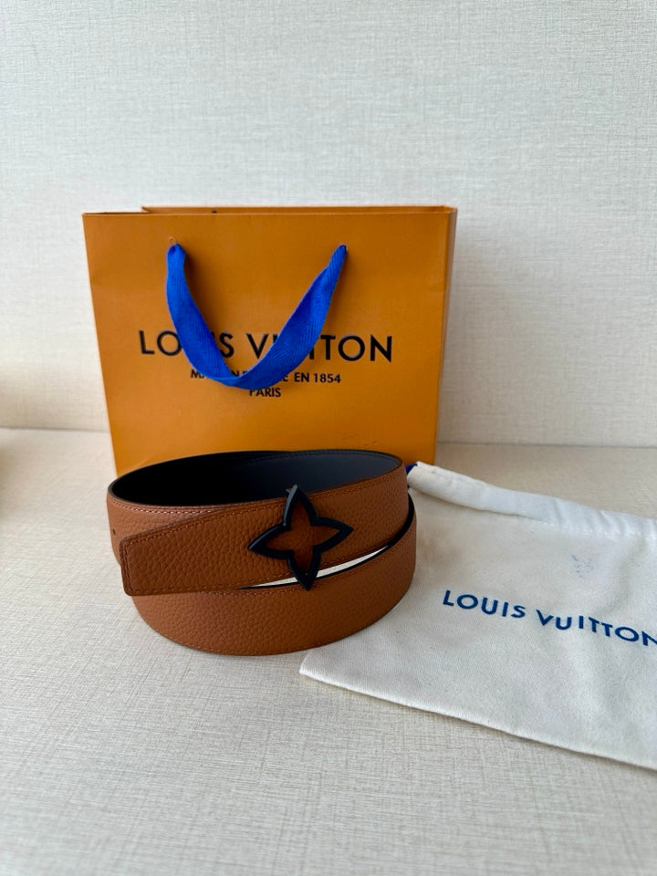 Louis Vuitton brown leather belt with star buckle, coiled on dark strap