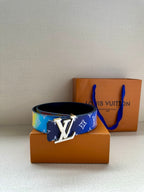 Blue and rainbow-trim designer belt with gold-tone buckle and monogram print