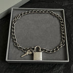 Silver-tone chain bracelet with padlock and key charm, in a gift box