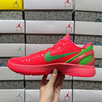 Red low-top sneaker profile with green swoosh and bold sole, side view