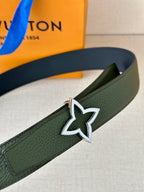 Green leather belt close-up with silver star buckle and edge stitching