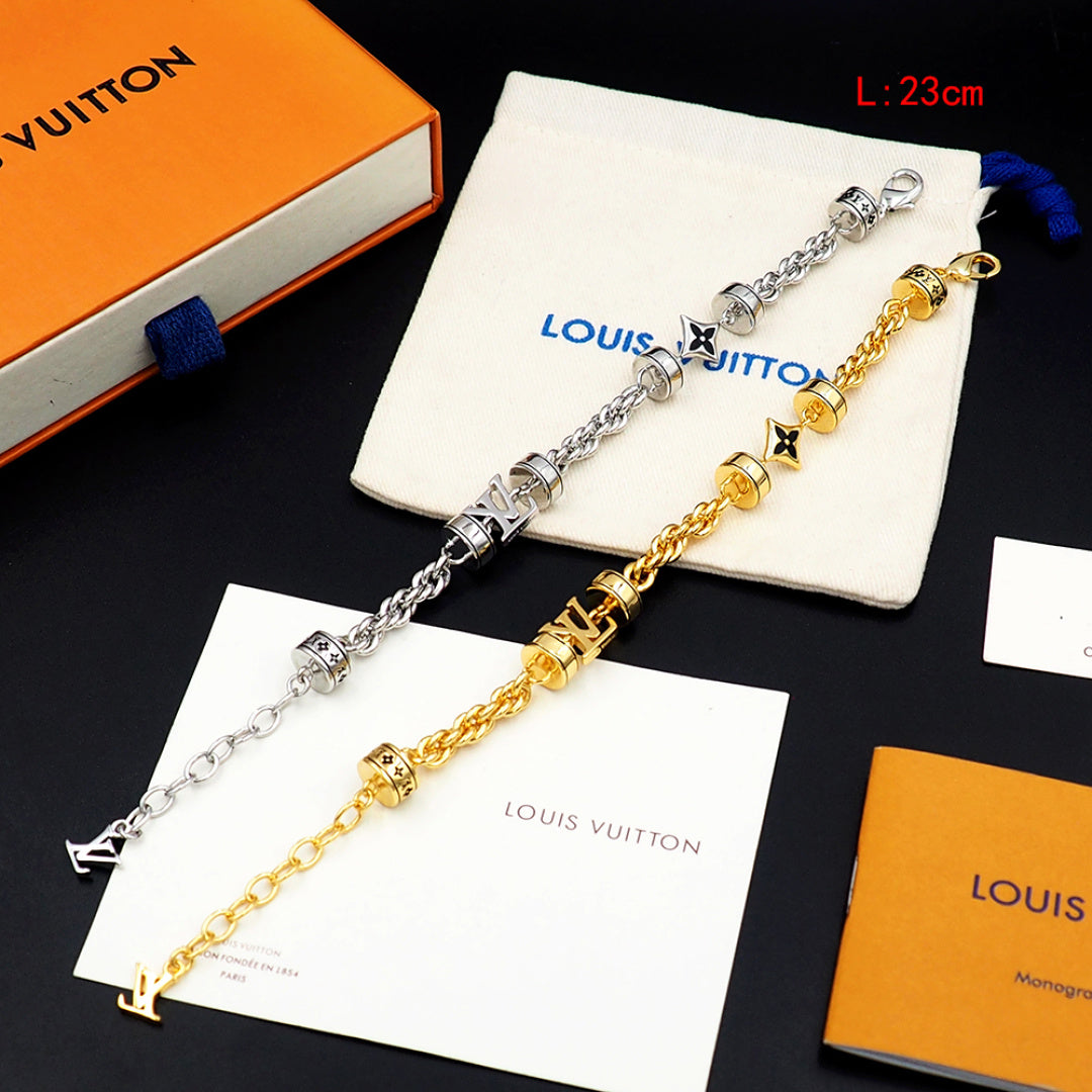 Louis Vuitton charm bracelet set, silver and gold linked chain with logo beads