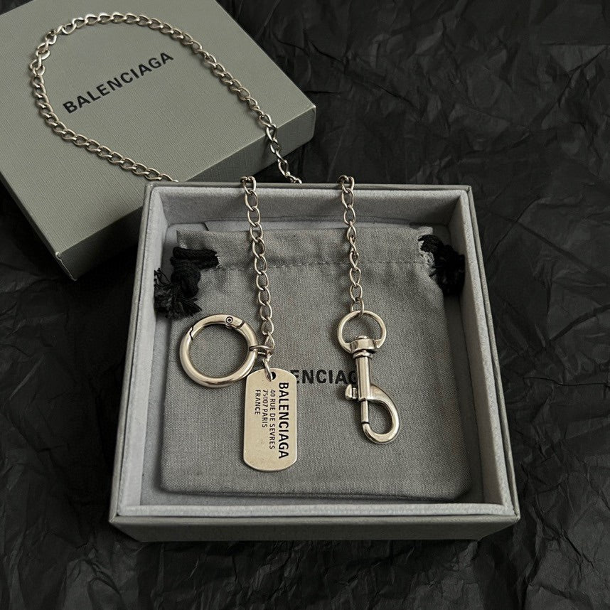 Balenciaga keychain set with chain, rings, and dog-tag charm in gift box