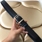 Dark blue belt with silver square buckle and adjustable strap holes
