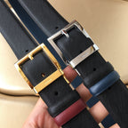 Prada belt pair, gold buckles on dark textured straps with burgundy trims