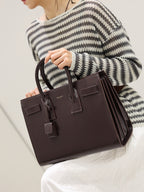 YSL structured leather tote bag with top handles and front flap, dark brown.