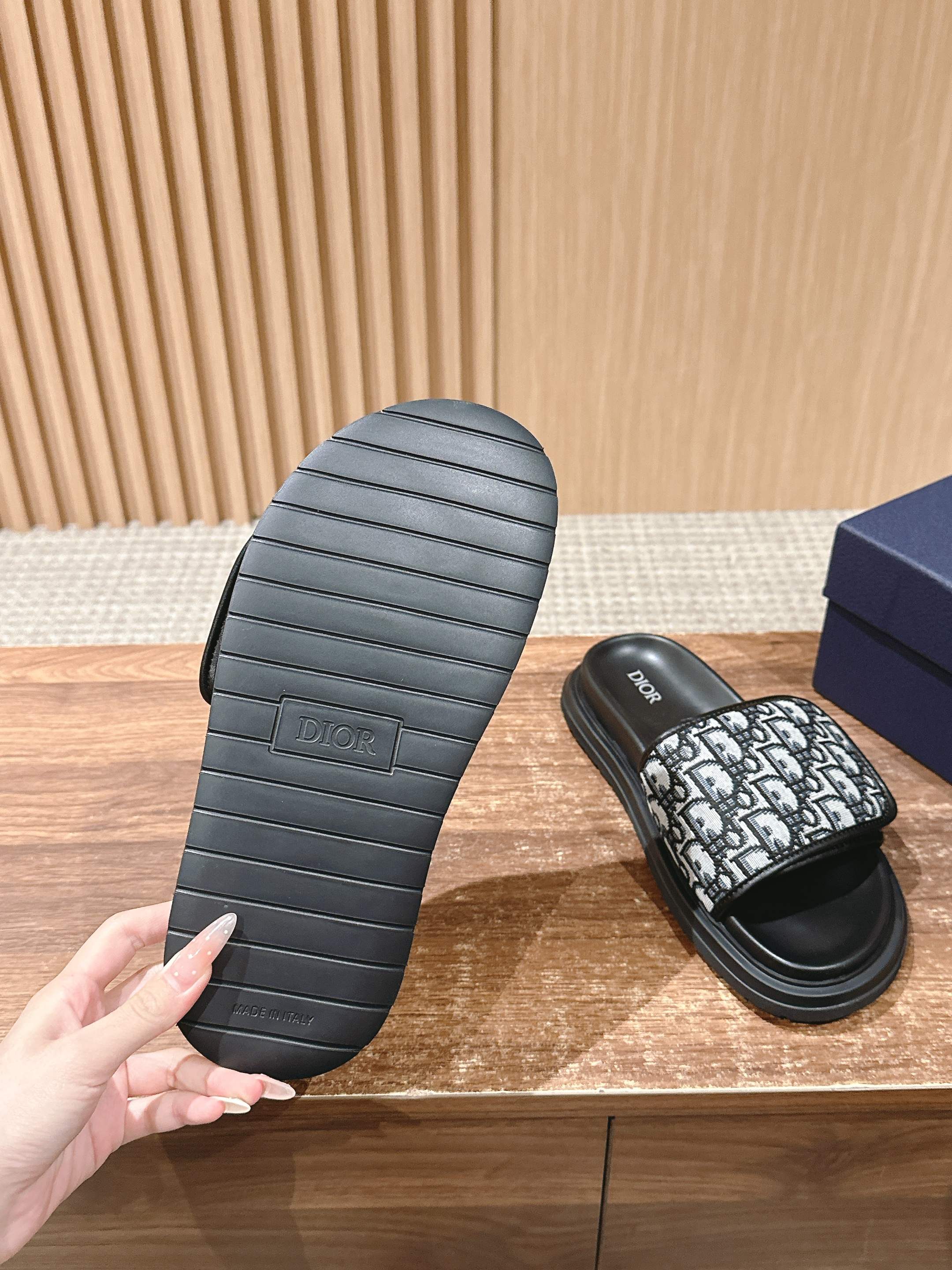 Dior sandals outsole view showing ribbed tread and Dior logo on sole