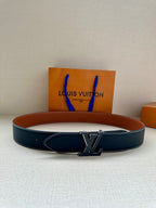 Louis Vuitton belt in dark blue leather with silver LV buckle and white edge stitching