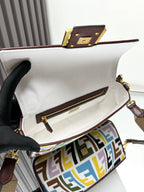 Baguette-style bag open view with leather zipper trim and inner pocket