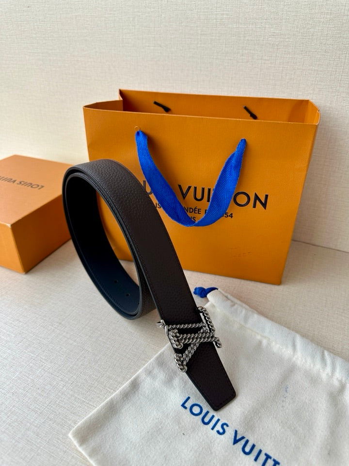 Louis Vuitton belt top view: dark leather strap with gold-tone chain hardware