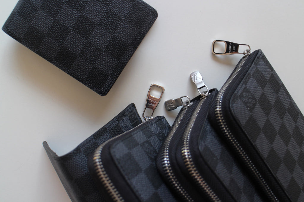 Louis Vuitton small zip pouches, dark checker pattern with silver zippers