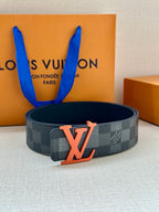 Louis Vuitton checkered belt with orange LV buckle on dark blue strap
