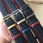Pair of belts: dark blue webbing with burgundy leather, silver-tone buckles