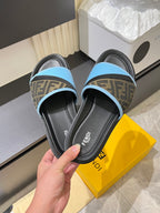 Fendi slide sandals: light blue strap with brown FF pattern on black footbed