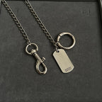 Balenciaga dog-tag keychains with metal rings on silver chains