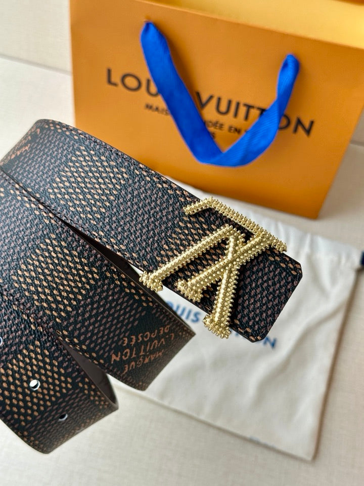 Dark monogram belt with gold LV rhinestone buckle and studded strap holes.