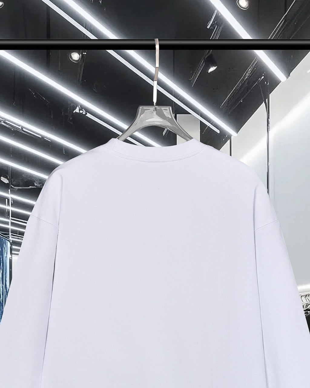 Moncler white long-sleeve sweatshirt with plain back, hanging on a hanger