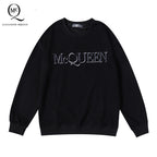 Black crewneck sweatshirt with McQUEEN logo