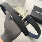 Dark Prada belt with gold buckle and navy strap accent on display