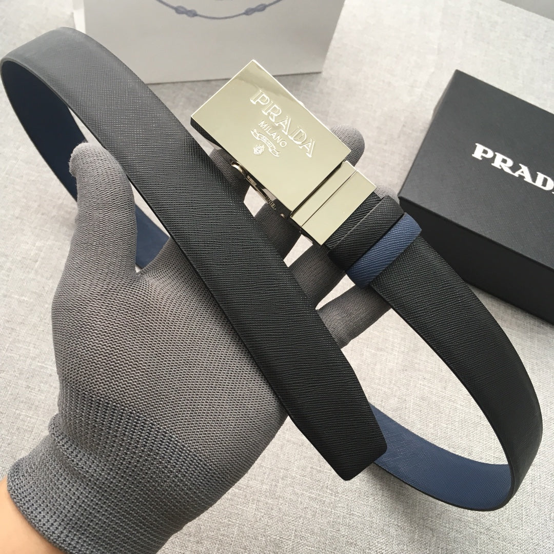 Dark Prada belt with gold buckle and navy strap accent on display