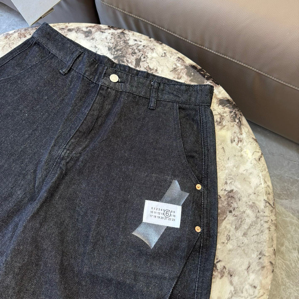 Dark denim shorts with front patch pocket and buttoned waist closure