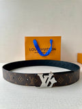 Louis Vuitton monogram belt with dark strap and gold-tone LV buckle