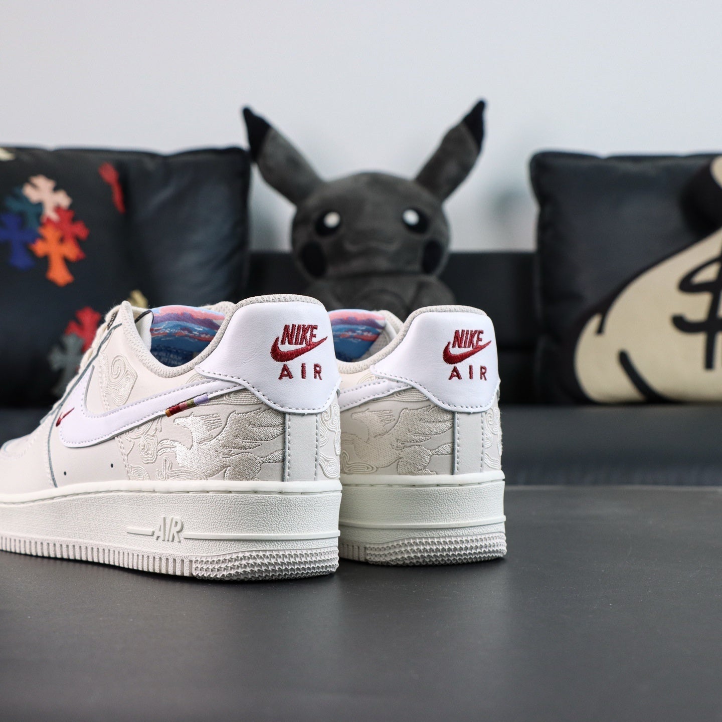 White Air Force 1 low sneakers with Nike Air heel tabs and red swoosh