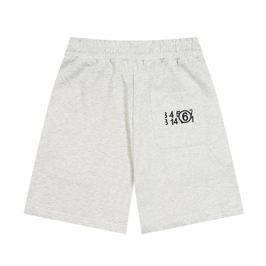 Heather gray Maison Margiela shorts with drawstring and logo graphic on front pocket.