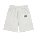 Heather gray Maison Margiela shorts with drawstring and logo graphic on front pocket.