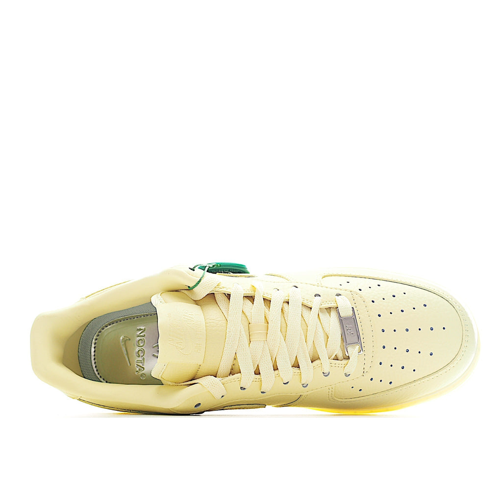 Air Force 1 low-top sneaker in pale yellow leather, lace-up side view with interior lining